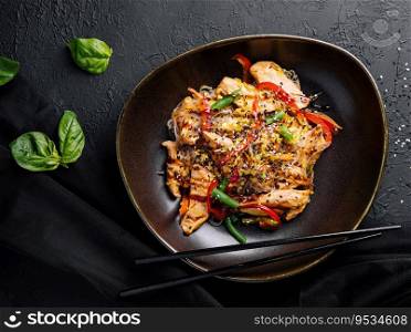 Asian udon noodles with chicken vegetables and teriyaki sauce