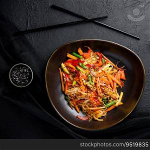Asian vegetarian udon noodles with vegetables in a bowl