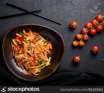 Asian vegetarian udon noodles with vegetables in a bowl