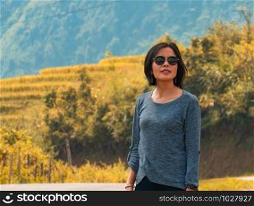 asian woman at golden rice terraces