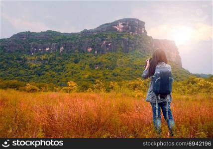 Asian woman backpacker . Asian woman backpacker take photo view of mountain