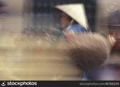 Asian Woman Carrying Baskets