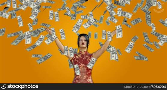 Asian Woman Catching Money Falling From the Sky in US Dollars