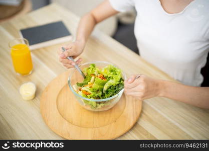 Asian woman dieting Weight loss eating fresh fresh homemade salad healthy eating concept.