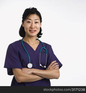 Asian woman doctor half length portrait against white background.