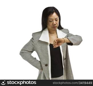 Asian woman dressed in business formal looking at wach on white background