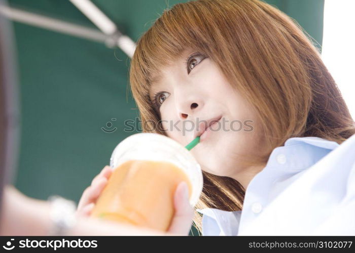 Asian woman drinking