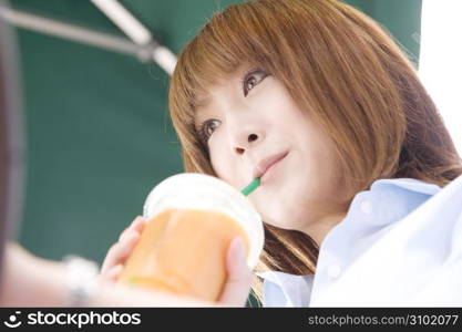 Asian woman drinking