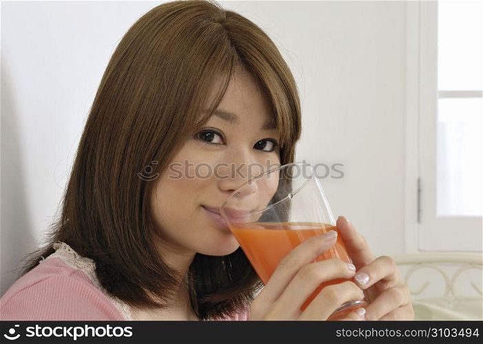 Asian woman drinking