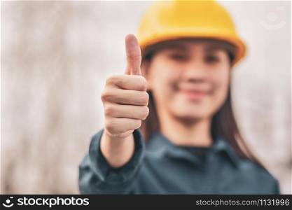 Asian Woman Engineering Yellow helmet hard hat safety