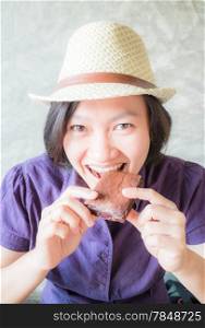 Asian woman enjoy eating bakery, stock photo