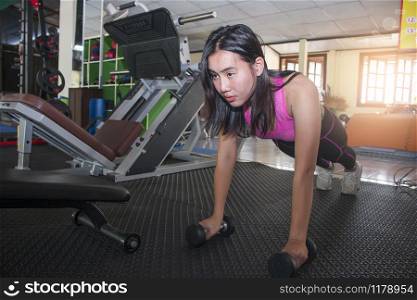 Asian woman exercising in the gym