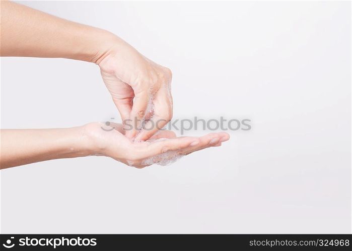 Asian woman hand are washing with soap bubbles on white background, Health and Lifestyle Concepts, Global Handwashing Day, hygienic practice