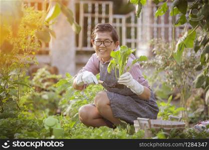 asian woman happiness emotion relaxing in home gardening activities