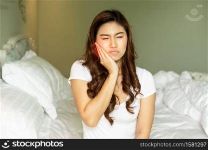 Asian woman have a toothache feeling so painful,Healthcare Concept