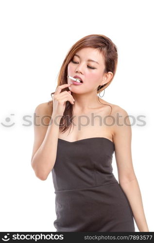 Asian woman in black dress with a cigarette smoking