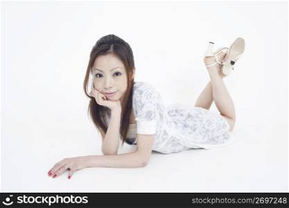 Asian woman in white dress