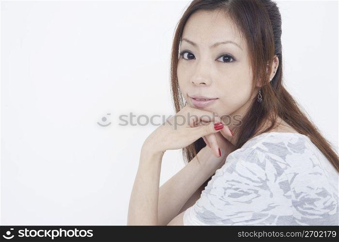 Asian woman in white dress