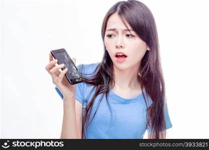 Asian woman looking at broken smartphone in disbelief