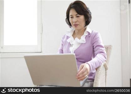 Asian woman on a laptop