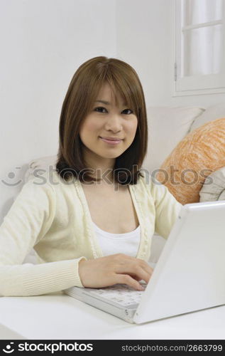 Asian woman on a laptop