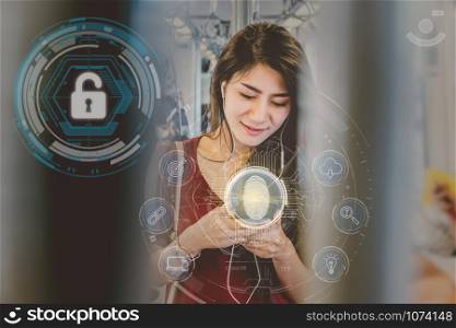 Asian woman passenger using the smart mobile phone by Fingerprint scan for support security access with biometrics identification in the Skytrain rails or subway, Business Technology sceurity Concept.