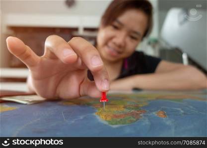 asian woman pinned on the map location