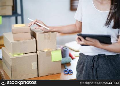 Asian woman preparing package delivery box Shipping for shopping online delivery mail service people and shipment concept.