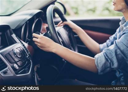 asian Woman &rsquo;s hands Push button Turn Signal, button the car,selective focus on hand
