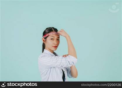 asian woman showing biceps