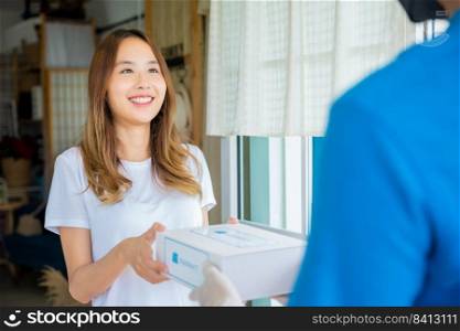 Asian woman sick she receive medication first aid pharmacy box hospital delivery service, Delivery man give medicine drug store to patient female at front home, healthcare medicine online business