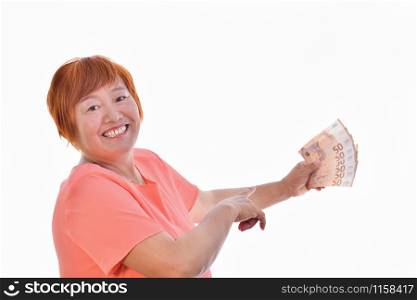Asian woman smiling with 50 euro banknotes in one hand and with the other pointing, isolated on white background. Commercial exchange concept.