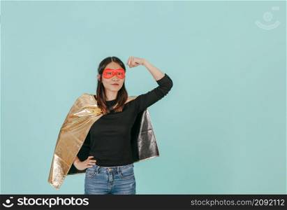 asian woman superhero costume showing biceps