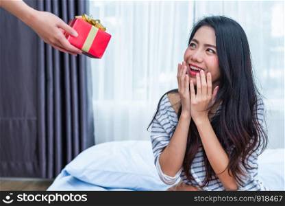 Asian woman surprised by the birthday gifts. People and lifestyles concept. Valentine and Birthday theme. Wedding and engagement theme. Happiness emotion
