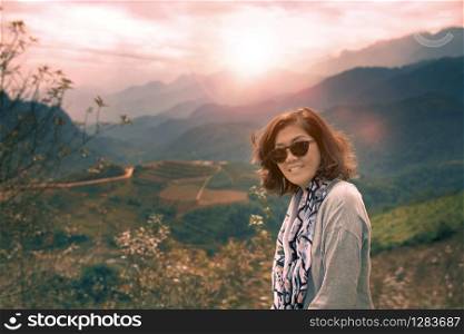asian woman toothy smiling face happiness emotion traveling in mountain range