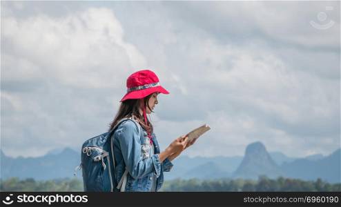 Asian woman traveler . Beautiful Asian woman traveler looking map ,travel concept with copy space
