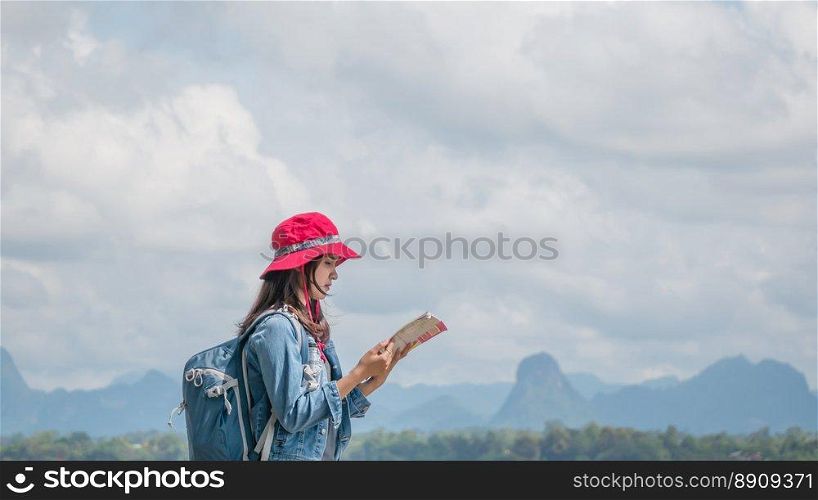 Asian woman traveler . Beautiful Asian woman traveler looking map  ,travel concept with copy space