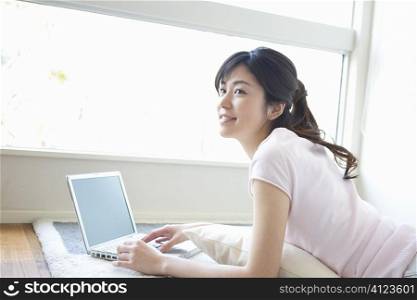 Asian woman using a laptop
