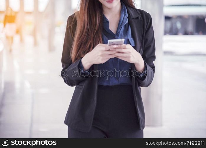 Asian woman using ipad shopping online website on smartphone with smiling face. Happiness asian woman holding cellphone checking mail from online shopping website read article Blog vlog social media