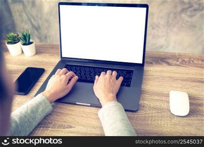 asian woman using laptop computer do online activity on wood table at home office.