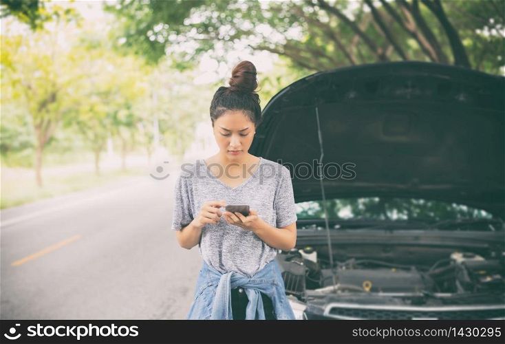 Asian woman using mobile phone while looking and Stressed man sitting after a car breakdown on street