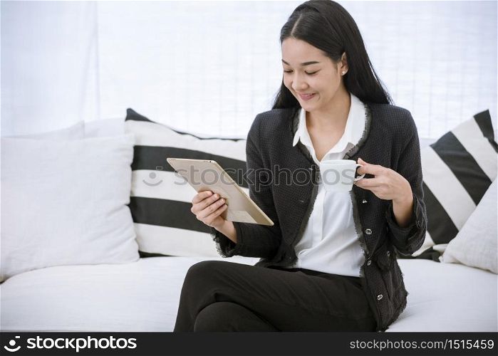 Asian woman using phone shopping online website on smart tablet hand point touch screen digital tablet. Woman holding smartphone checking mail online shopping website read article vlog social media