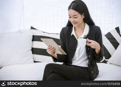 Asian woman using phone shopping online website on smart tablet hand point touch screen digital tablet. Woman holding smartphone checking mail online shopping website read article vlog social media