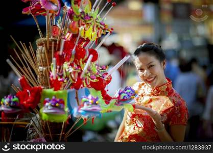asian woman wearing chinese tradition clothes toothy smiling face in yaowarat chinatown bangkok thailand