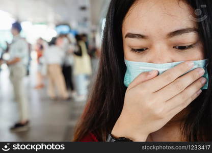 asian woman wearing protective mask against virus and air pollution in public transport.