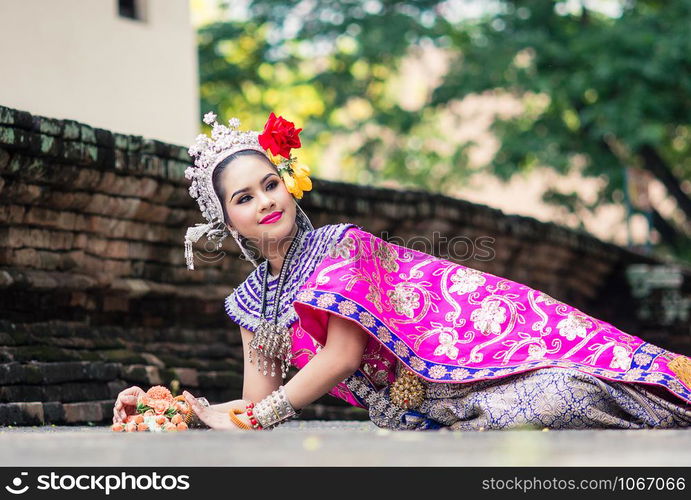 Asian woman wearing typical, traditional Thai Dress. It is literally means