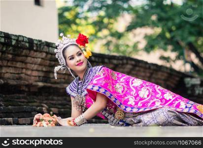 Asian woman wearing typical, traditional Thai Dress. It is literally means