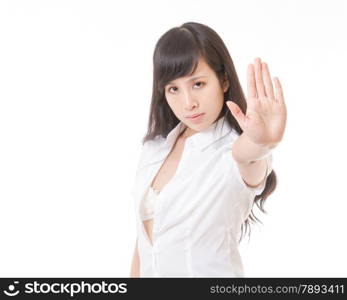 Asian woman with shirt unbuttoned making stop hand sign