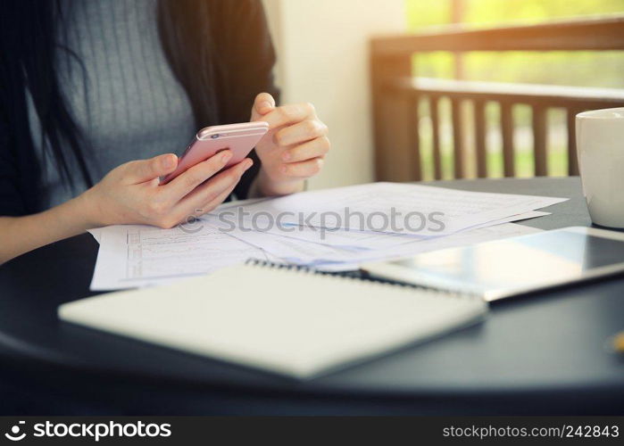  Asian woman with smart phone with business