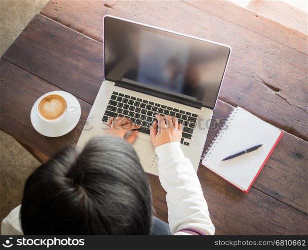 Asian woman working online with wireless gadget, stock photo